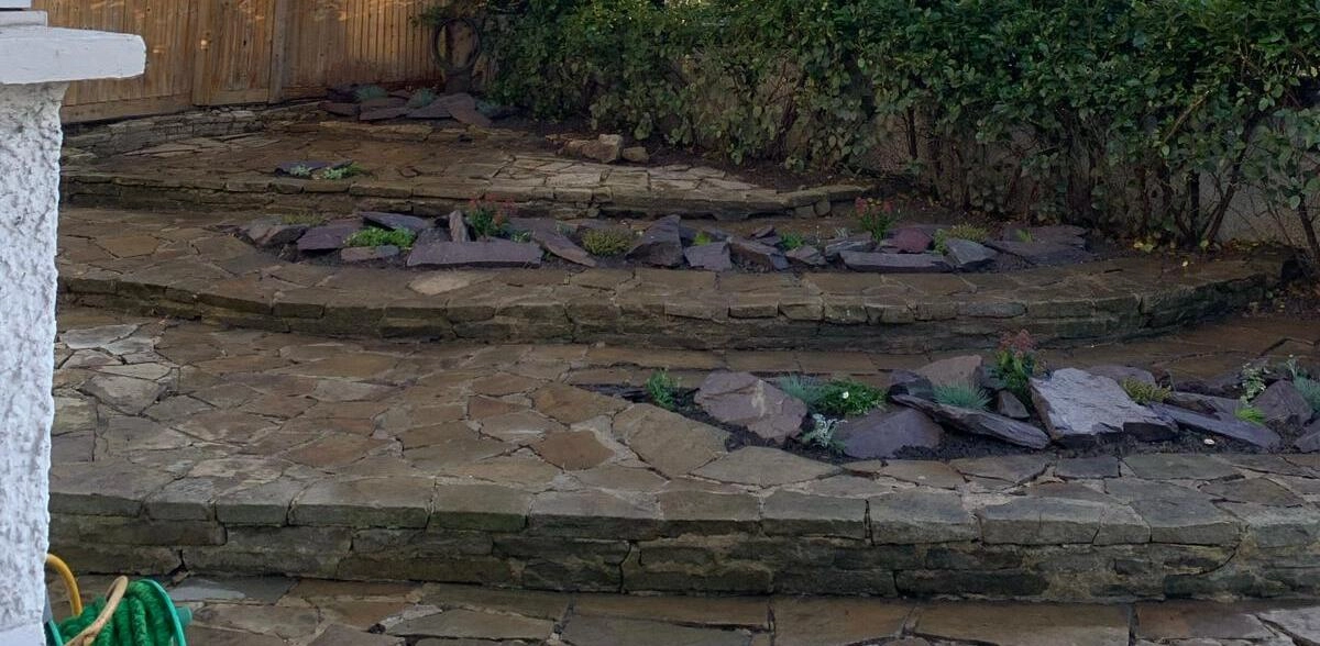 messy garden before a complete space tidy up in wandsworth